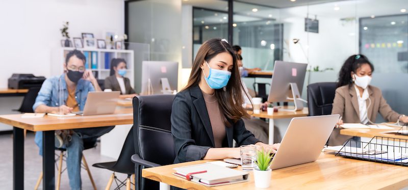 panoramic group business worker team wear protective face mask new normal office with social distance practice with hand sanitiser alcohol gel table prevent coronavirus covid 19 spreading - Lionheart safety